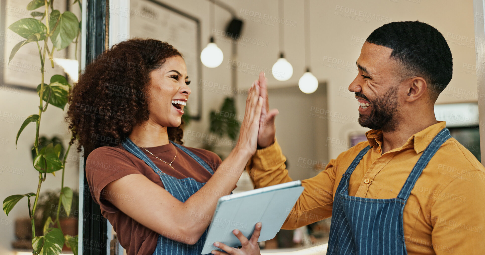 Buy stock photo Happy waiters, celebration and high five with tablet for teamwork, success or sale together at cafe. Business people or employees touching with smile on technology for online startup at coffee shop