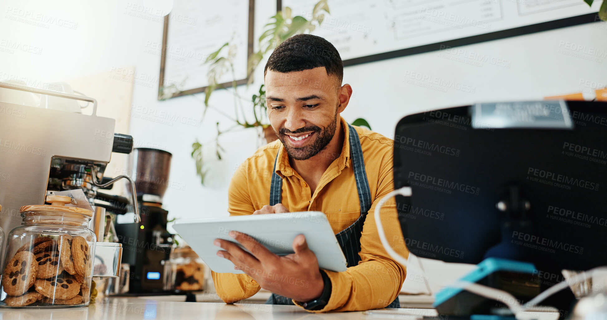 Buy stock photo Waiter, happy and tablet in coffee shop for business, online order and delivery service platform. Male barista, tech and software in restaurant for POS, stock management or company information update