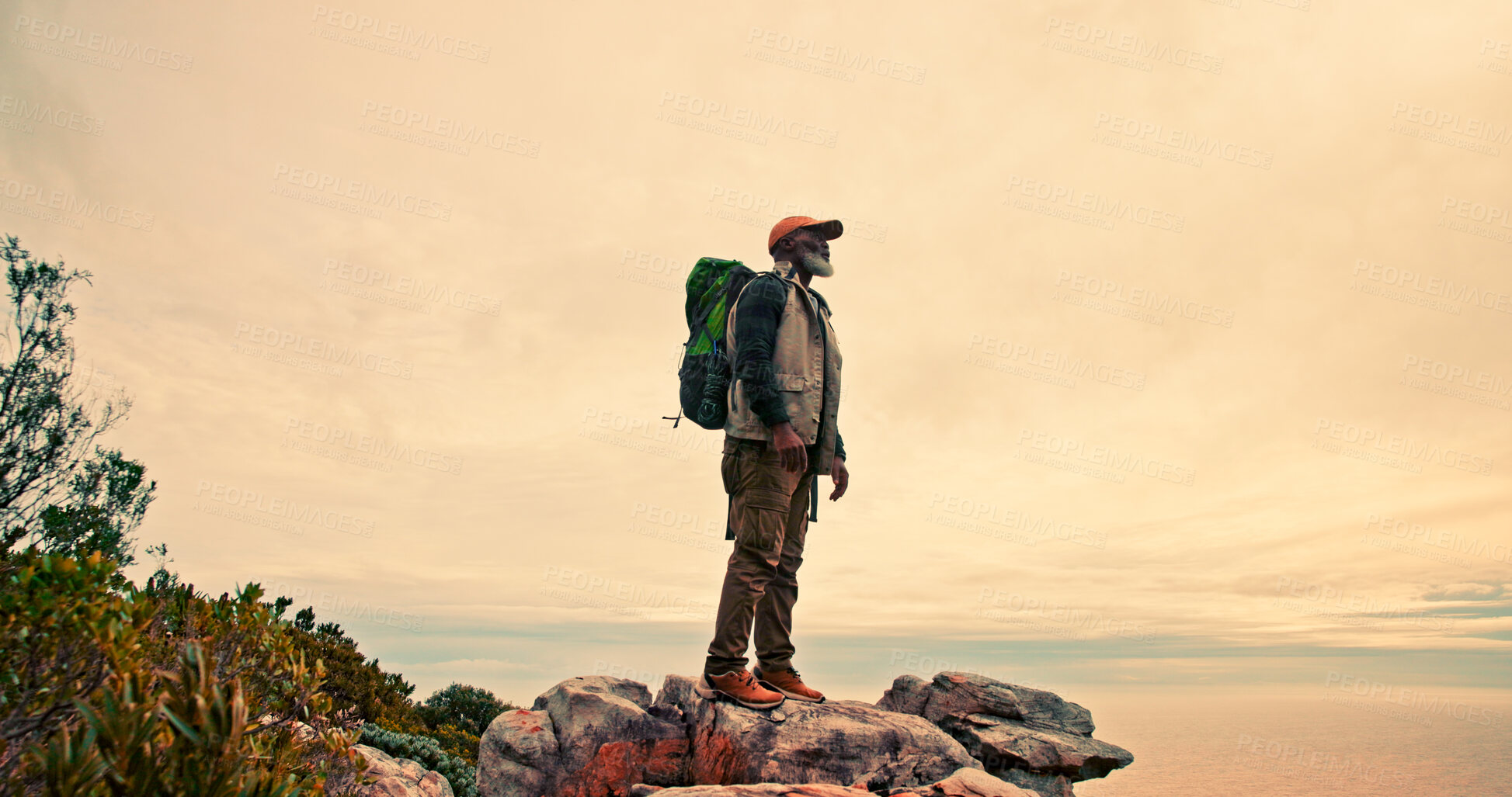 Buy stock photo Sky, mountain peak or black man hiking for view in outdoor adventure in nature for travel or break. Mature, clouds mockup space and hiker on hill for holiday vacation, exercise or trekking to explore