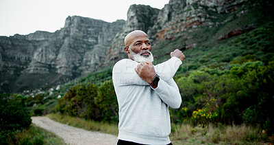 Buy stock photo Runner, outdoor and senior black man stretching on road for fitness, health and running in retirement. Arms, exercise and male person in nature thinking of for workout, cardio warm up and training