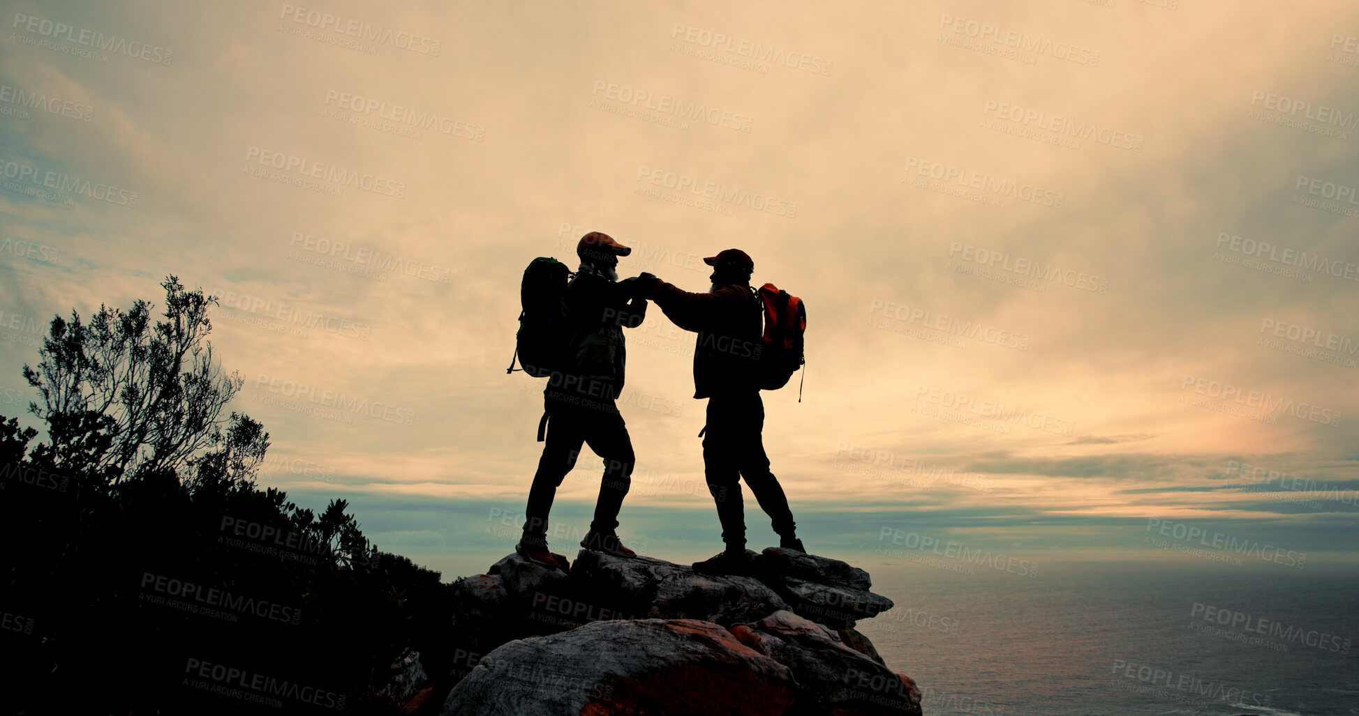 Buy stock photo High five, silhouette and success with friends on mountain peak together for fitness, hiking or view of ocean. Celebration, sky and support with hiker people in nature for exercise, hobby or vacation