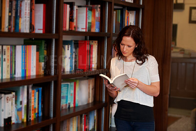 Buy stock photo Woman, book and reading in a library, store or bookstore customer and student with a novel to buy, read or study. Girl, bookshelf and studying books for college, university or research information