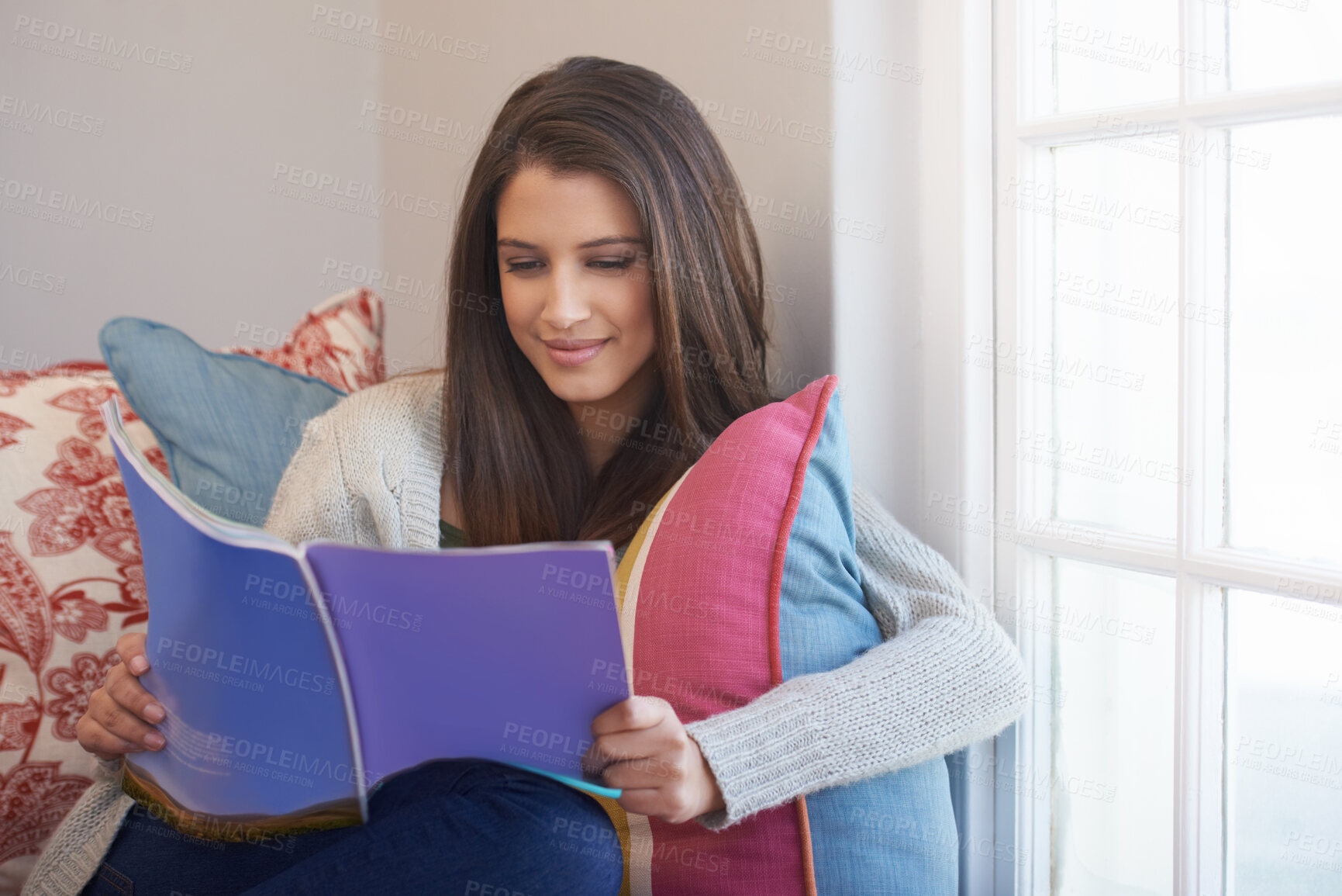 Buy stock photo Woman, beauty magazine or reading book in home for skincare tips, knowledge or press news to relax. Female person, smile or information for learning, fun gossip story or resting on chair on weekend