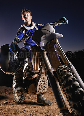 Buy stock photo Portrait of a young motocross rider posing on his bike