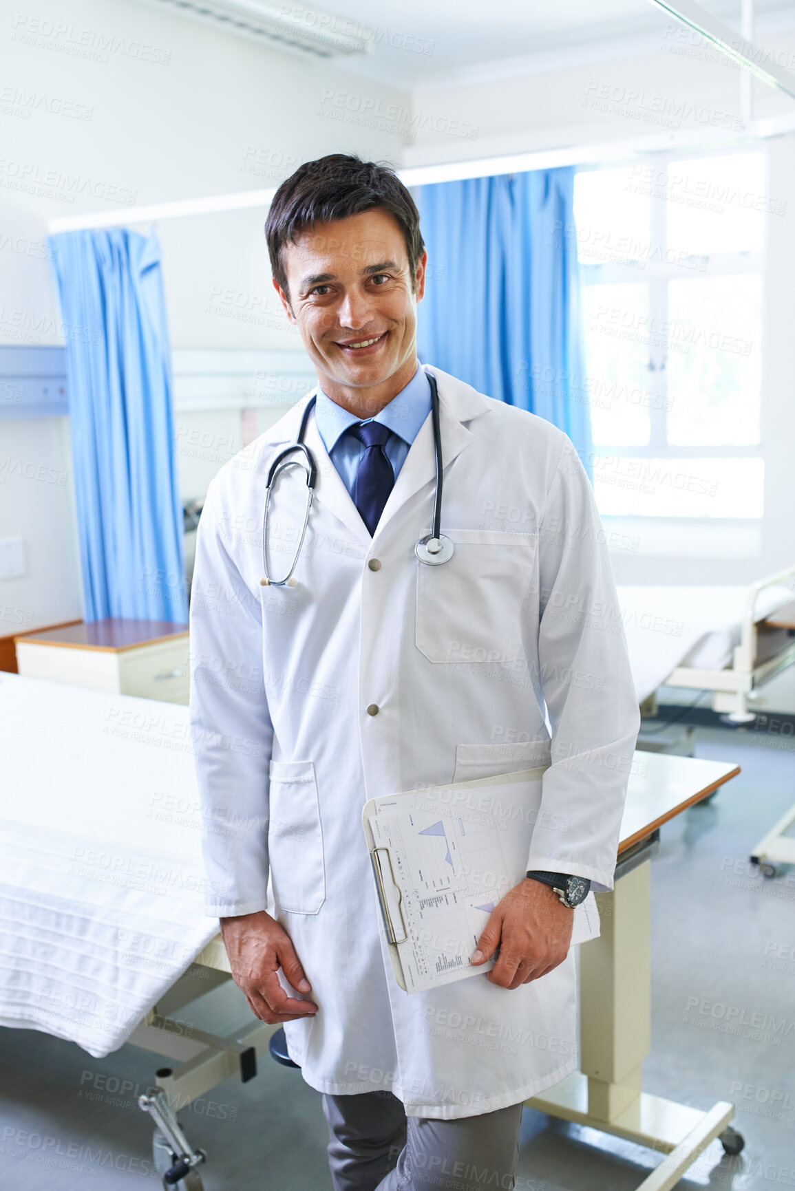 Buy stock photo Portrait, doctor and man with clipboard, proud and happy for first day in hospital, smile and expert. Clinic, medical professional and confidence of person, healthcare and lab coat for employee