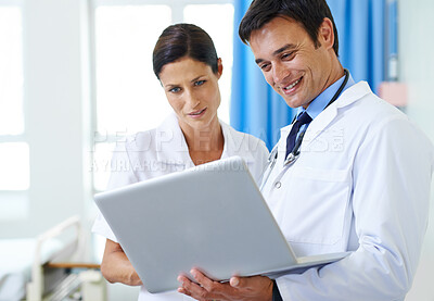 Buy stock photo Doctor, nurse and discussion with laptop in hospital for patient records, results and review medical diagnosis. Man, woman and online for clinical documentation, treatment planning and administration