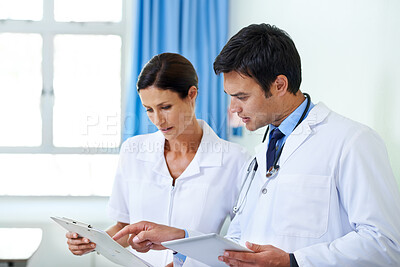 Buy stock photo Doctor, nurse and communication with tablet in hospital for patient records, results and review medical diagnosis. Man, woman and clipboard for clinical documentation, treatment planning and admin.