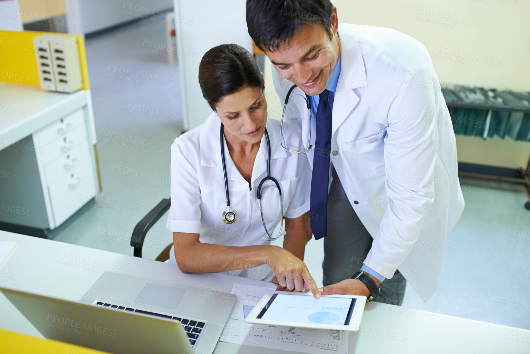 Buy stock photo Doctor, nurse and reception discussion on tablet, talking and planning for patient schedule in clinic. Medical worker, healthcare service and people together, teamwork and email results in hospital
