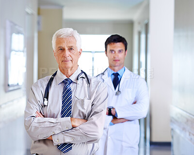 Buy stock photo Portrait, doctor and mature man with arms crossed, serious and leadership in hospital, proud and expert. Clinic, medical professional and confidence of people, healthcare and services for employee