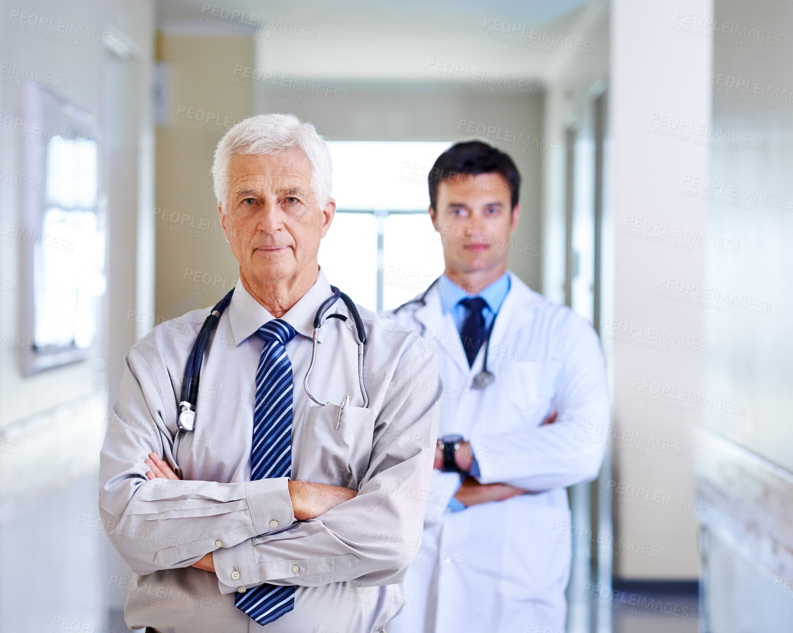 Buy stock photo Portrait, doctor and mature man with arms crossed, serious and leadership in hospital, proud and expert. Clinic, medical professional and confidence of people, healthcare and services for employee