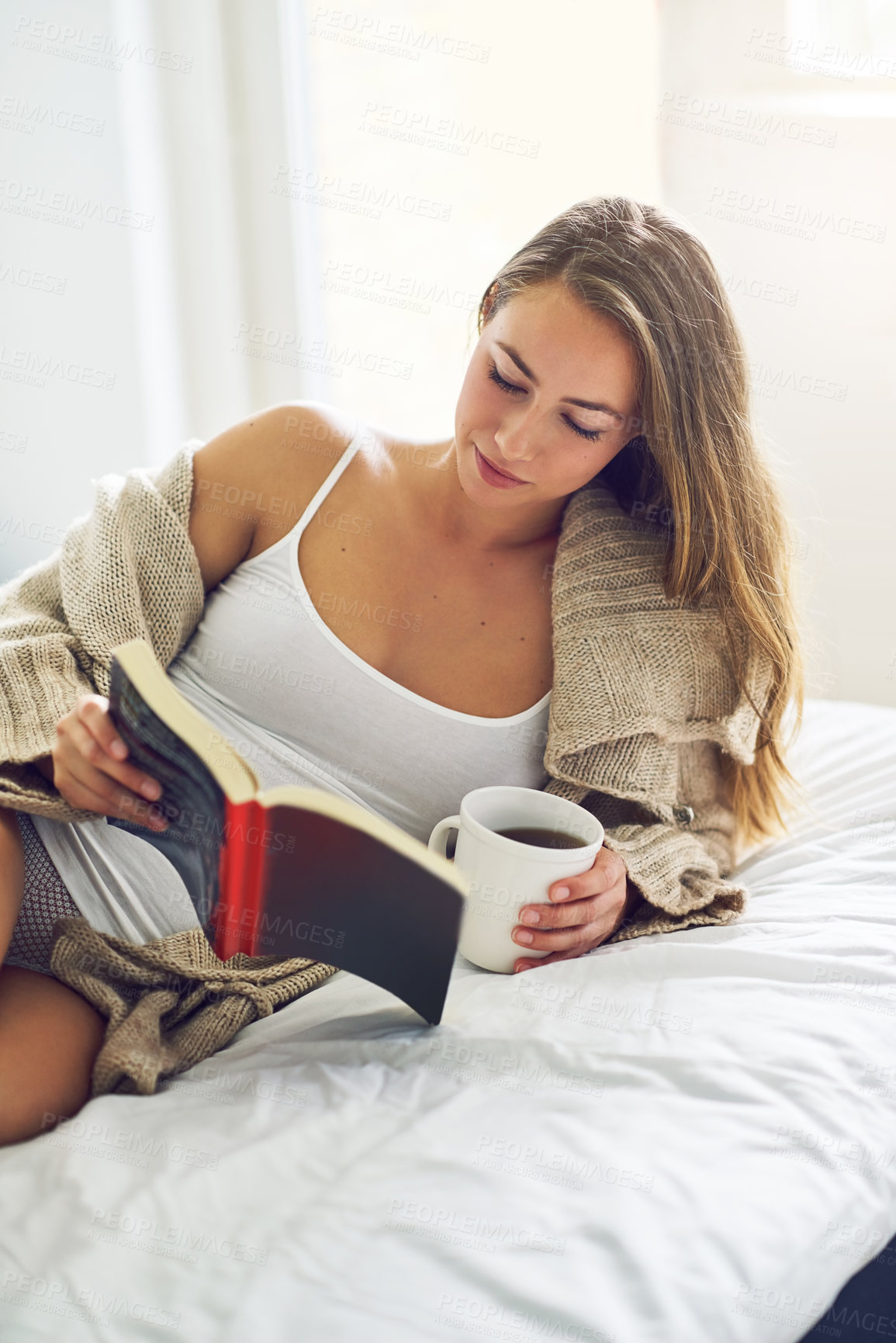 Buy stock photo Woman, drinking coffee and reading book in bedroom for romance story, relax and morning. Bed, tea and girl with novel for literature, studying information and learning knowledge with espresso in home