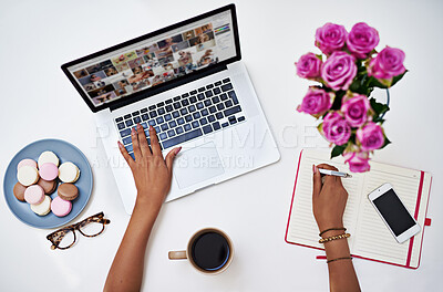 Buy stock photo Above, hands and laptop with notebook, writing and flowers as professional for digital agency in home. Person, creative and freelancer in research, web design and typing for remote work as designer