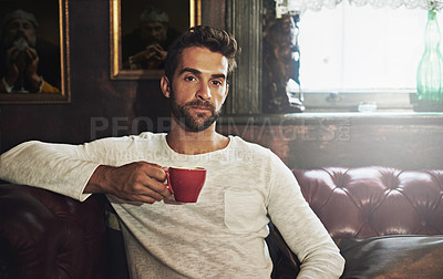 Buy stock photo Cafe, portrait and man on sofa with tea, hospitality and customer service for beverage in bistro. Restaurant, couch and male person with pride for atmosphere, warm coffee and espresso in morning