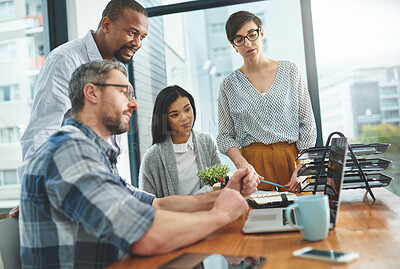 Buy stock photo Shot of businesspeople working together in the office 