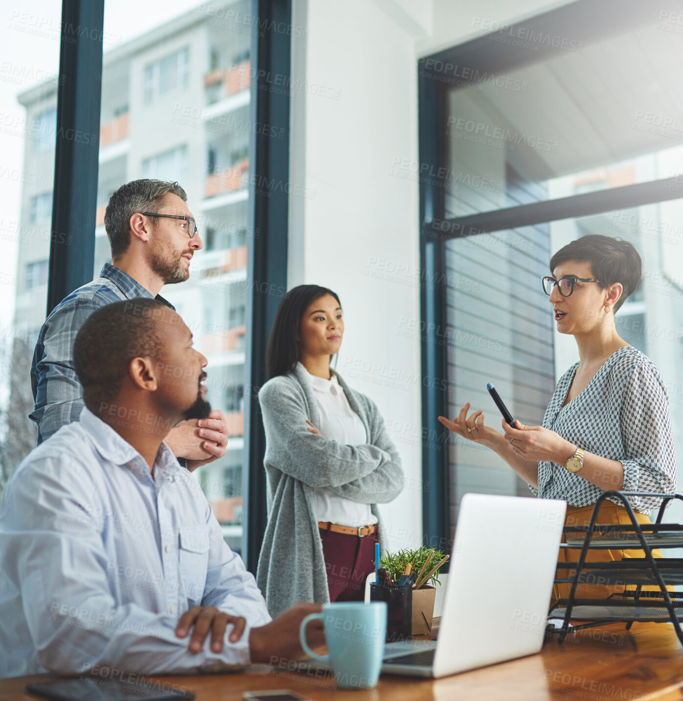 Buy stock photo Shot of businesspeople working together in the office 