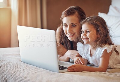 Buy stock photo Mother, kid and relax in bedroom with laptop for streaming subscription, cartoon and online video in home. Happy family, woman and girl on bed with technology for social media, bonding and child film