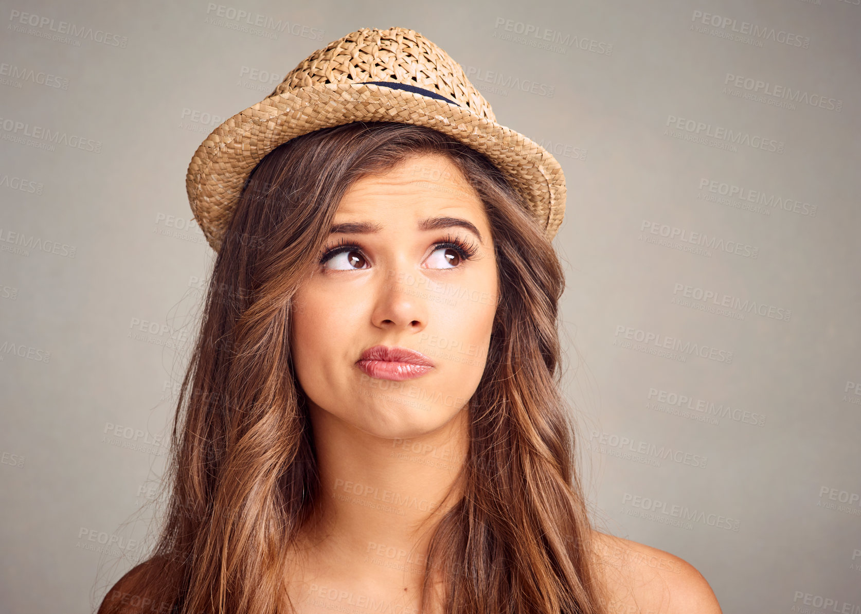 Buy stock photo Thinking, idea and woman in studio with straw hat for international summer trip, vacation or holiday. Planning, unsure and person dreaming of global travel, tourism or adventure by gray background.