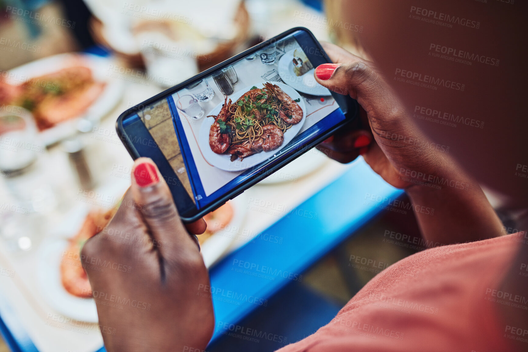 Buy stock photo Food, smartphone and hands at restaurant for photography, social media or status update from behind. Woman, influencer screen and meal at cafeteria for blog, post or online review for followers