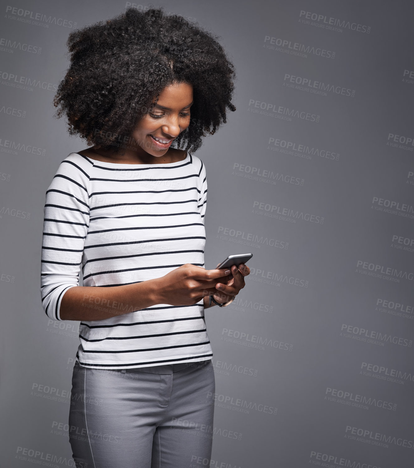 Buy stock photo Phone, fashion or black woman in studio for social media, text message or internet connection. Mobile, technology or African girl on website for clothes deal, news or chat online on grey background