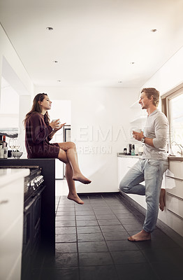 Buy stock photo Chat, love and couple in kitchen with coffee, morning discussion and bonding together in home. Drink, happy man and woman talk with care, connection and relax with relationship support in apartment