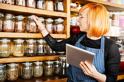 Buy stock photo Barista, woman and tablet for coffee shop inventory or online order on website in startup cafe. Small business owner, waiter and review with technology for stock menu or price checklist in store