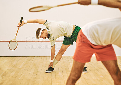 Buy stock photo Man, stretching and sport with squash racket in court for game, match or getting ready for competition. Young male person, friends or players in body warm up for practice, tournament or fitness