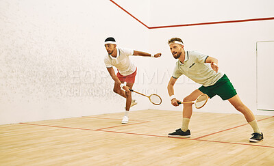 Buy stock photo Man, friends and serve with squash racket for game, sports or intense match together in court. Young male person or athletic players in fitness, competition or training for smash, point or score