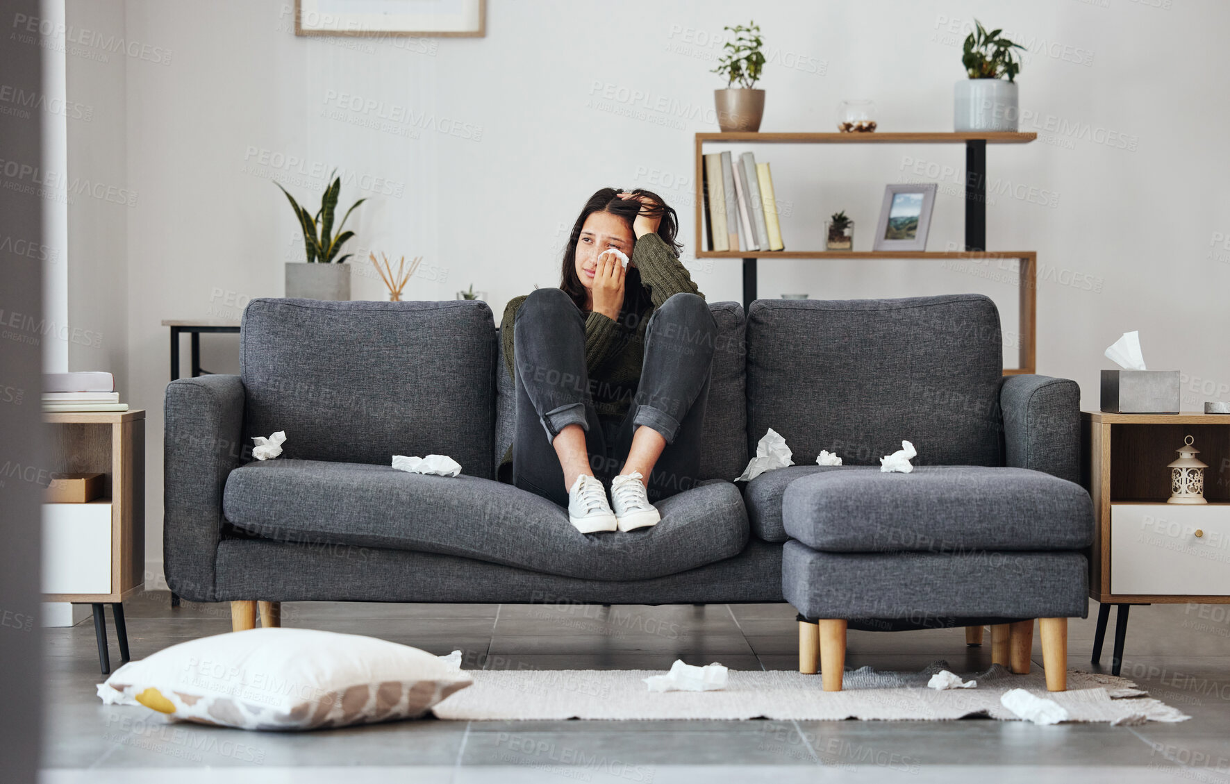 Buy stock photo House, crying and woman with depression, thinking and mental health on sofa, sad or emotions. Victim, apartment or girl with tears, tissue or breakup with anxiety, panic attack or stress with burnout