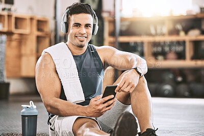 Buy stock photo Fitness, man and portrait with smartphone, headphones for music and exercise tracker, app and workout progress. Male person, happy and gym with training playlist, audio and online for cardio tips.