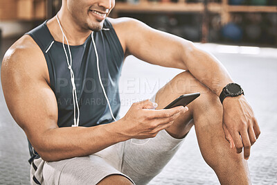 Buy stock photo Fitness, man and hands in gym with smartphone for music, exercise tracker and apps for workout progress. Male person, happy and earphones for training playlist, audio and online for cardio tips.