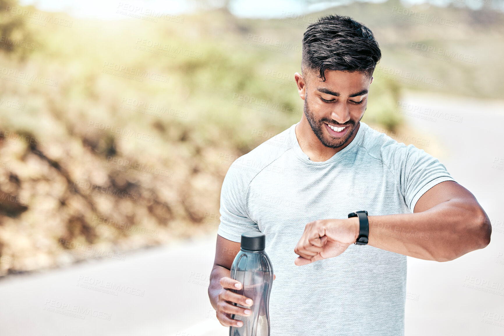 Buy stock photo Outdoor, man and fitness on checking digital watch with smile to monitor or tracking health, wellness and wellbeing. Male person, water bottle and happy with running results, heart rate or progress