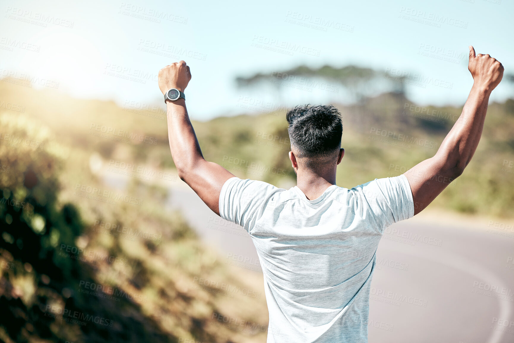 Buy stock photo Man, fitness and back with celebration in nature for winning, achievement or goal on asphalt road. Active male person or victory for workout, training or milestone in race, sprint or running exercise