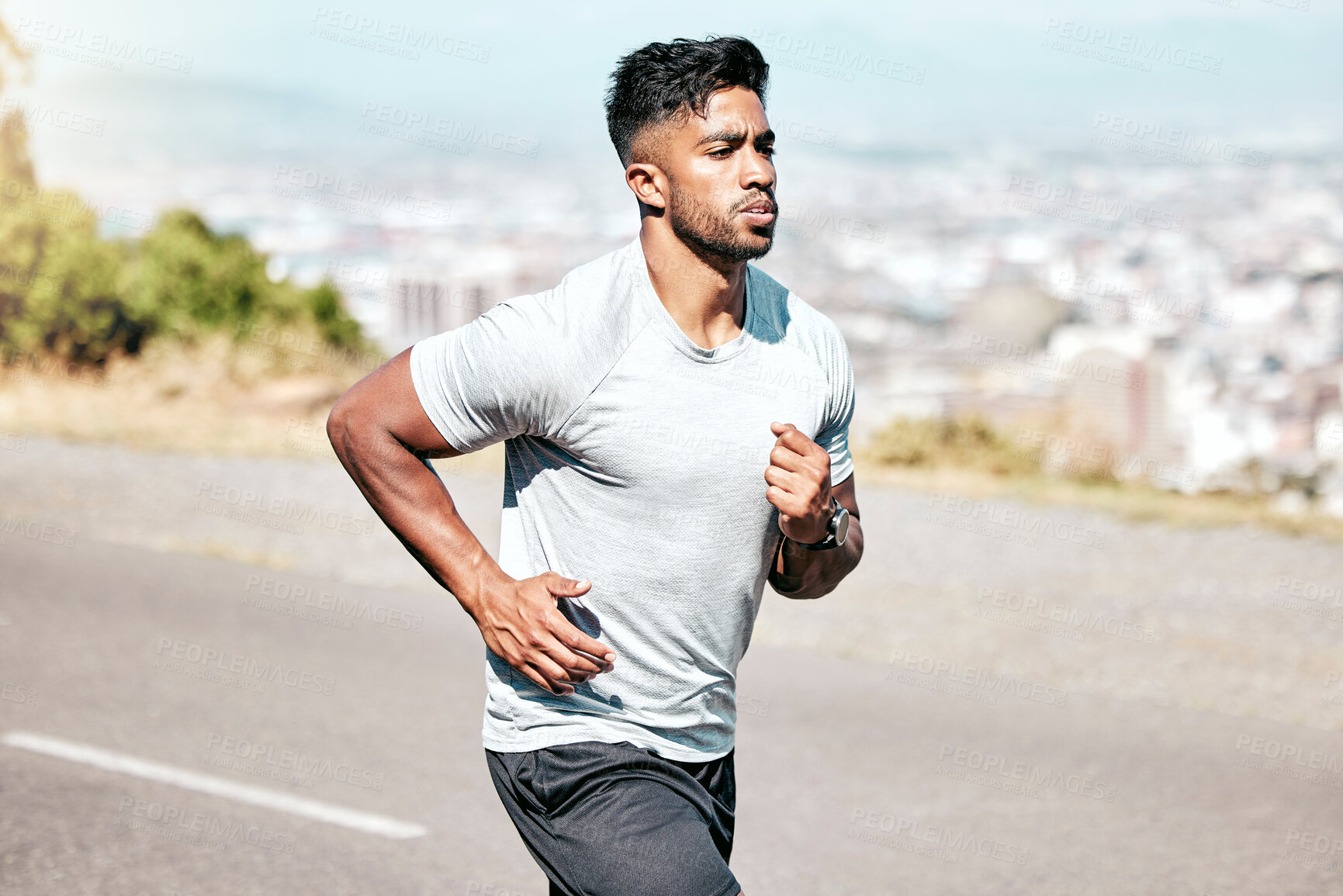 Buy stock photo Indian man, runner and running for fitness on road for exercise, training and workout for race. Endurance, motion and athlete in outdoor long distance practice for wellness, speed progress and health