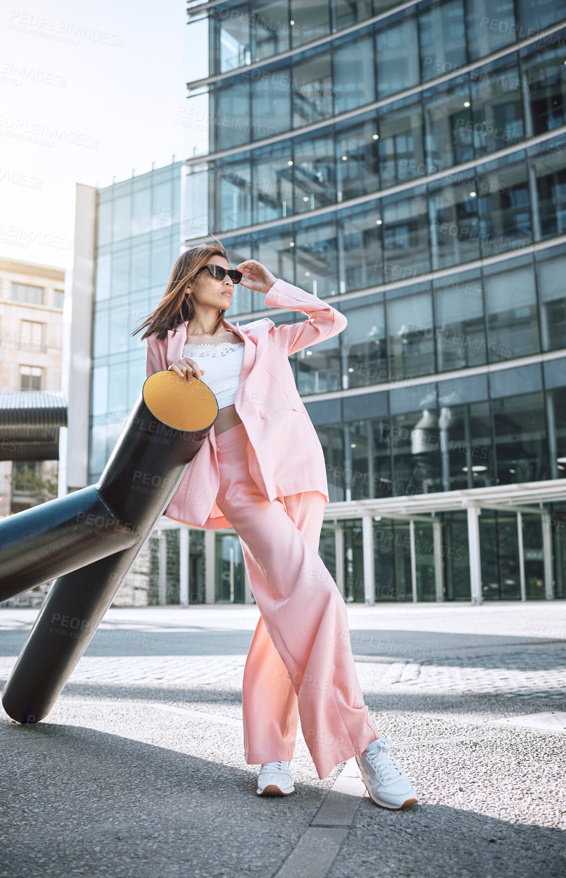 Buy stock photo Sunglasses, trendy woman and fashion in city with thinking, attitude and designer clothing. Stylish, pink suit and accessories by building for outfit, urban downtown and gen z promotion on street