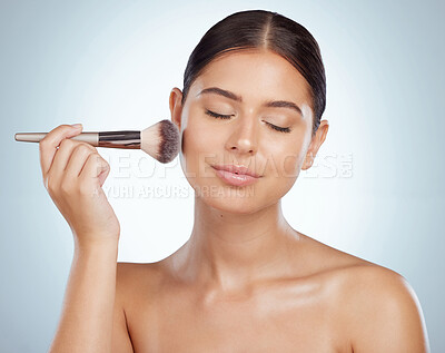 Buy stock photo Beauty, makeup and woman with brush for glow, face and aesthetic isolated on white studio background. Cosmetics, product and model apply foundation or powder for skincare treatment with eyes closed