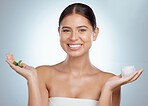 Portrait of smiling beautiful woman using aloe vera in skincare routine. Caucasian model isolated against grey studio background and posing with copyspace. Organic plants for hydration and moisture