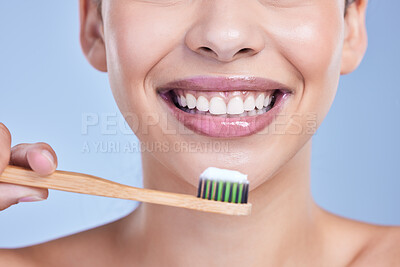 Buy stock photo Happy, bamboo toothbrush and mouth of woman isolated on blue background for smile. Studio, eco friendly or closeup of model with wood brush or paste for brushing teeth, dental cleaning or oral health