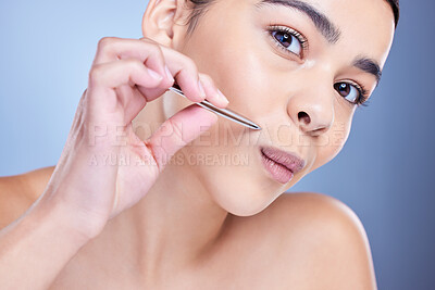 Buy stock photo Woman, portrait and tweezers for hair removal in studio, beauty and pluck mustache on blue background. Female person, grooming and treatment for skincare, cleaning and cosmetic tool for maintenance