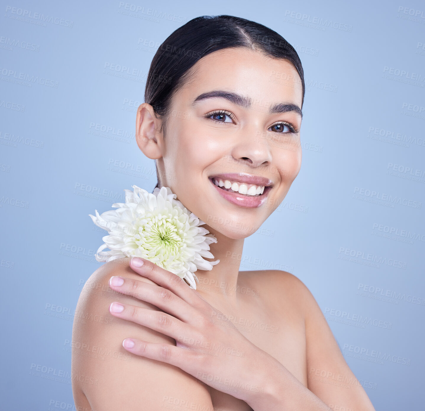 Buy stock photo Flower, portrait or woman with natural beauty on blue background with smile, pride or glow. Face, confident person or girl model in studio with floral cosmetics, plants or skincare for facial results