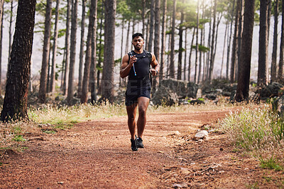 Buy stock photo Running, man and serious with exercise in forest for healthy body, cardio or fitness in morning. Person, athlete and trees with workout in nature for sports, wellness or training for weekend marathon