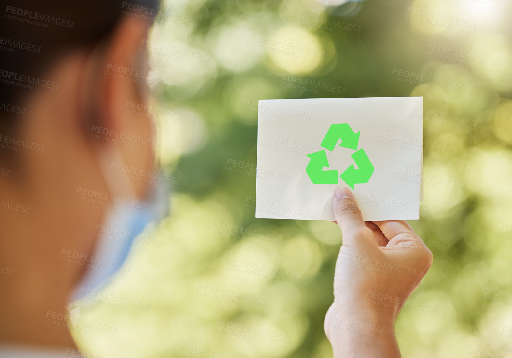Buy stock photo Recycle, logo and hand of woman in nature with sign for sustainability, waste management or forest care. Park, planet and eco volunteer with green arrow icon for climate change, pollution or cleaning