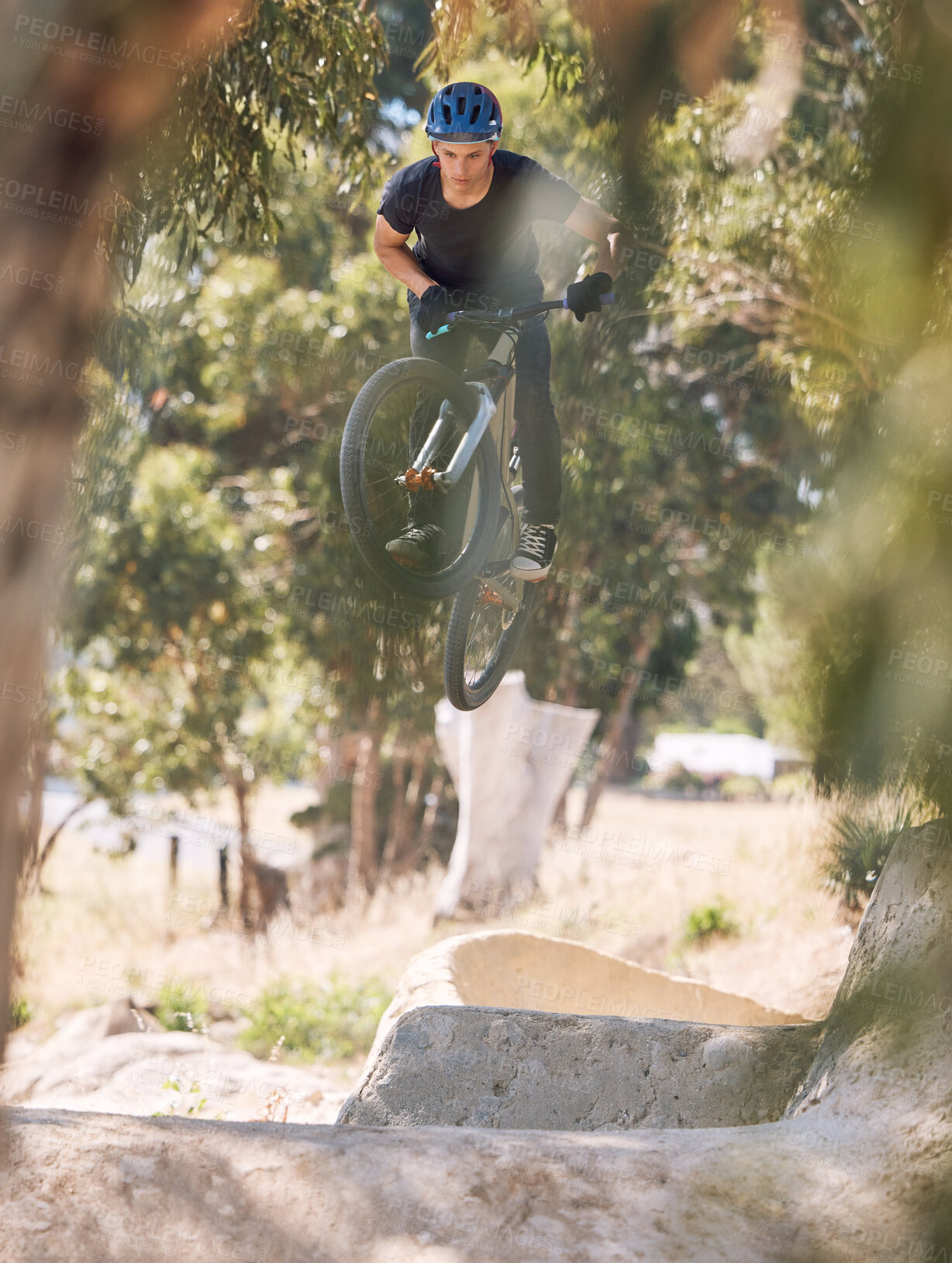 Buy stock photo Sports, trail and man jump on bicycle for training, competition and exercise in countryside. Fitness, cycling and person on mountain bike in air for adventure, freedom and adrenaline on dirt path
