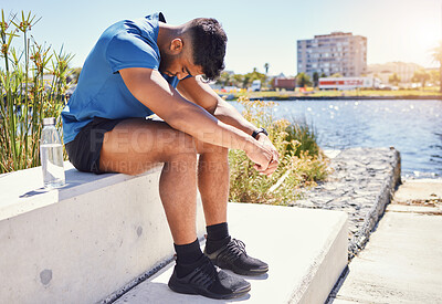 Buy stock photo Sad, tired runner or man in city on break in outdoor exercise, fitness challenge or running sports. Upset, anxiety or exhausted athlete disappointed by stress, low energy or depression in training