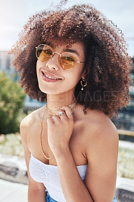 Buy stock photo Woman, portrait and sunglasses in city for fashion, stylish and confident with smile in Spain. Outdoor, female person or curly hair with trendy accessories on vacation, holiday or pride for cool look