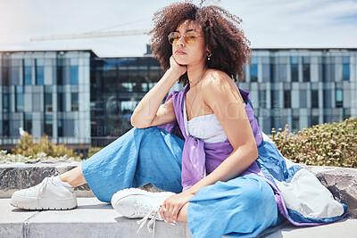 Buy stock photo Woman, portrait and hipster in city for fashion, stylish and cool with confidence in Spain. Outdoor, female person and curly hair with trendy sunglasses on vacation, holiday and edgy for accessory