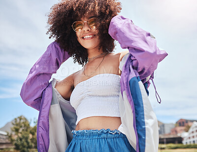 Buy stock photo Woman, portrait and edgy in city for fashion, stylish and cool with confidence in Spain. Outdoor, female person and curly hair with trendy sunglasses on vacation, holiday and hipster for accessory