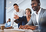 Happy caucasian female call centre telemarketing agent discussing plans with diverse colleagues while working together on computer in an office. Consultants troubleshooting solution for customer service and sales support