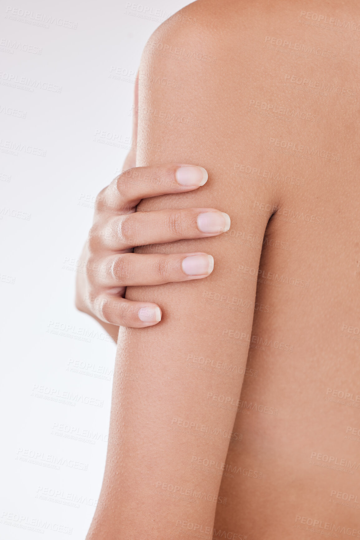 Buy stock photo Injury, woman and arm pain in studio with muscle tension or bruise on white background for emergency. Hurt, closeup and hand of girl touching body with inflammation, skin rash and treatment problem