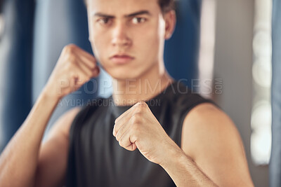 Buy stock photo Man, portrait and hands in fist in gym for fighting tournament, boxing match and training for competition. Male person, serious and ready for challenge or sport, self defense and mma performance.