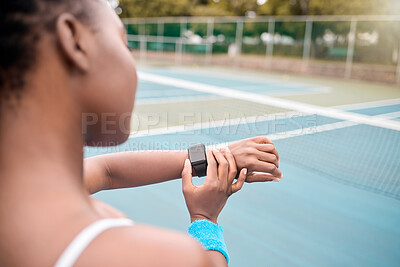 Buy stock photo Tennis, woman and hands on court with smart watch, timer and check resting heart rate. Athlete, sport and tech at outdoor club for progress, fitness tracking and notification on screen for stopwatch